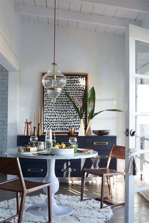 Design ideas for an eclectic dining room in melbourne with white walls, light hardwood floors and beige floor. Pin on New House