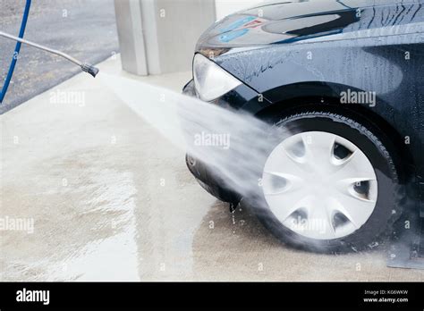 Pressure Water Jet Cleaning A Car Wheel Stock Photo Alamy