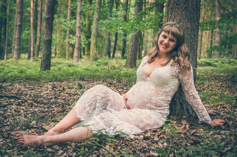 Beautiful Pregnant Woman In White Lace Dress In Forest Stock Photo Image Of Dress Life