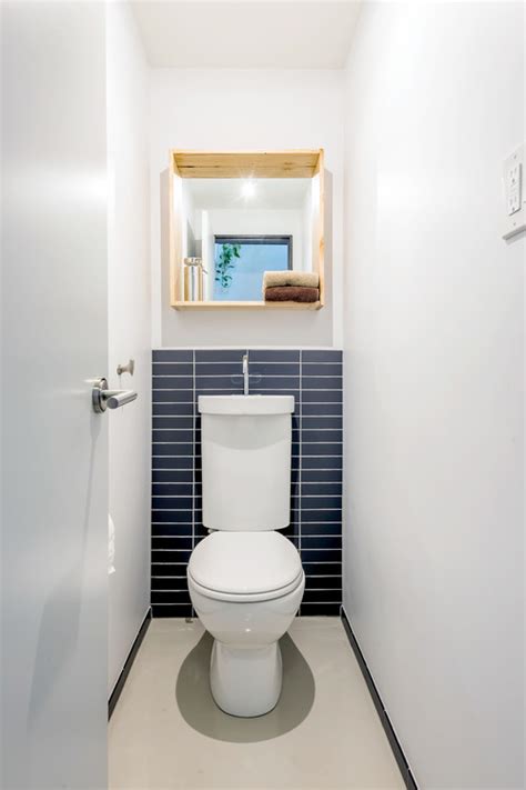 Separate the toilet area from the tub and sink zones with a partition. 8 Bathroom Designs That Save Space