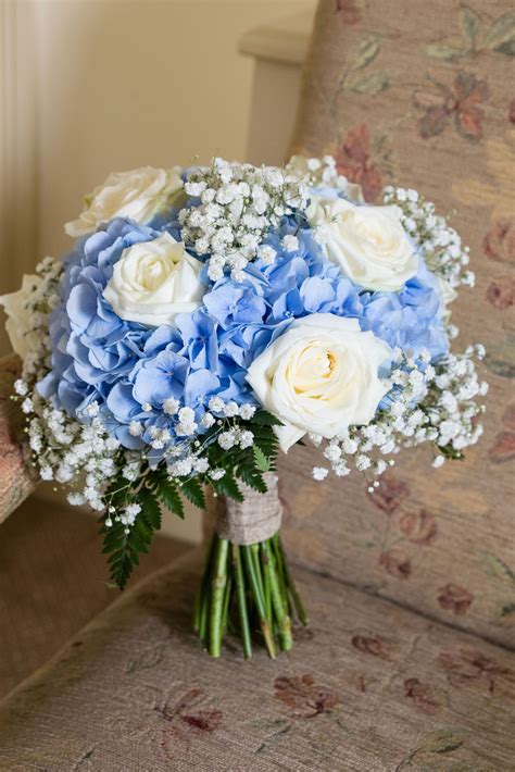 Maybe you would like to learn more about one of these? brooklodge wedding bride bouquet blue and white roses and ...