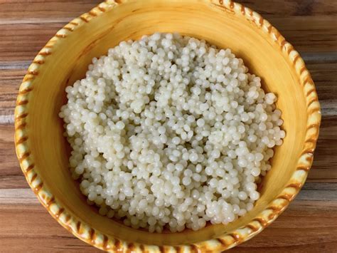 An aromatic dish perfect for lunch and pearl couscous (mograbieh) is a type of pasta. Lemon Herb Pearl Couscous 2 - The Genetic Chef