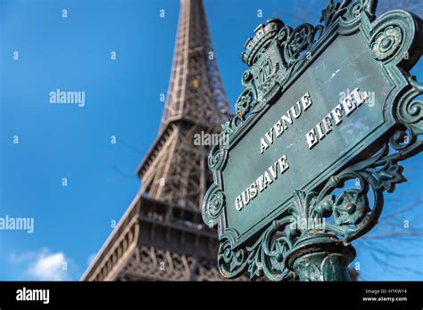 Looking Up At The Avenue Gustave Eiffel Sign With The Eiffel Tower