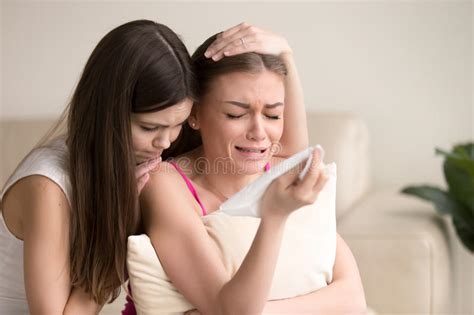 Young Woman Tries To Comfort Crying Female Friend Stock Image Image