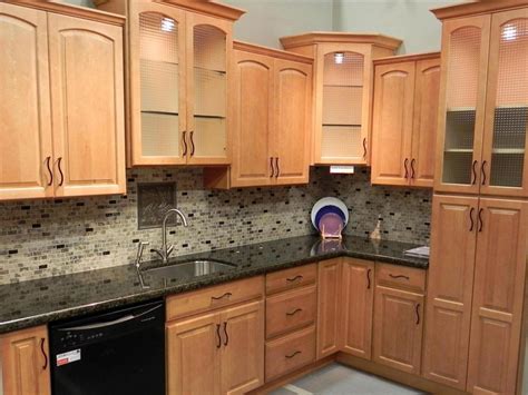 There are hundreds of color choices and thousands of opinions about the best kitchen colors. Oak Cabinet with Dark Countertops | Maple kitchen cabinets, Kitchen design, Corner kitchen cabinet