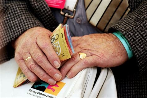 We did not find results for: A bookie holds money at a horse race - ABC News ...