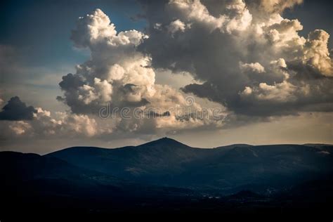 Beautiful Sunset Over Mountains With Storm Clouds In