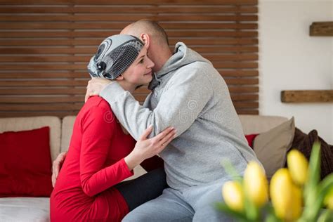 Supportive Husband Kissing His Wife Cancer Patient After Treatment In Hospital Cancer And