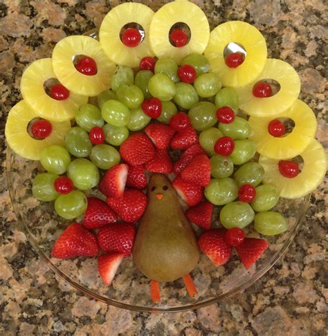 Fruit Arranged In The Shape Of A Pomegranate Pears And Strawberries