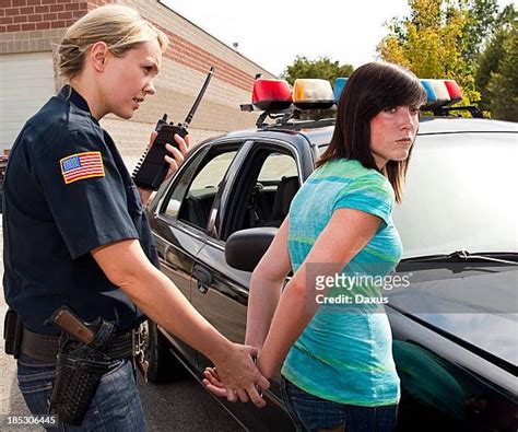 Woman Arrested Handcuffed Photos And Premium High Res Pictures Getty