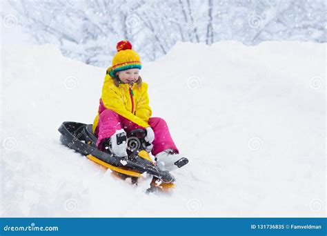 Little Girl Enjoying A Sleigh Ride Child Sledding Toddler Kid Riding