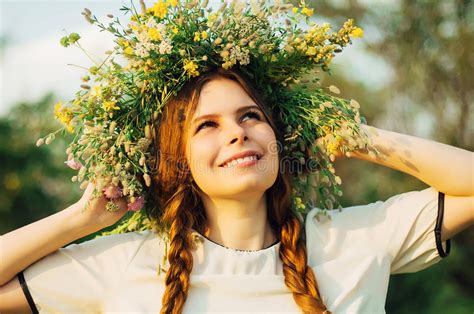 Beautiful Girl In Wreath Of Flowers In Meadow On Sunny Day Portrait Of Young Beautiful Woman