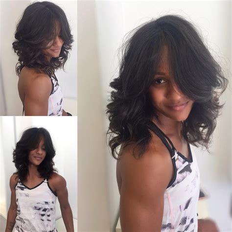 Wavy Shaggy Layered Cut with Center Parted Face Framing Layers and Dark Color - The Latest ...