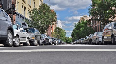 Two Rows Of Cars Parking Along Street In City Free Image Download