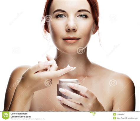 woman applying cream on her face stock image image of beauty cream 41584493