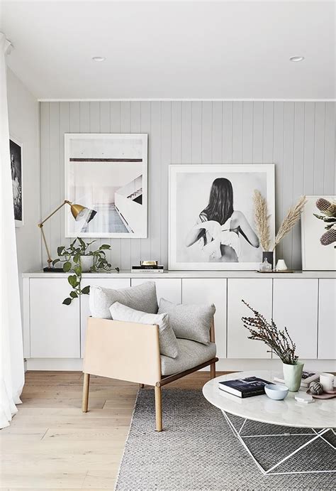 This Scandi Style Living Room Features Grey Panels Behind A Art Gallery