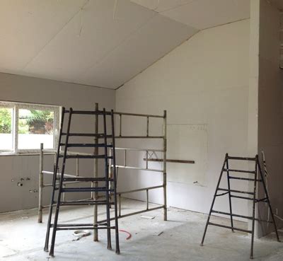 The ceiling is well insulated in the loft space. Installing plasterboard walls and insulation | BUILD