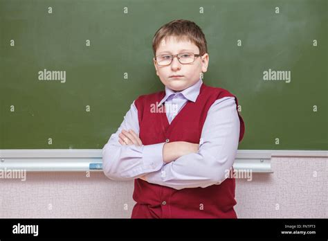 Boy Standing With His Arms Crossed At A School Board Stock Photo Alamy