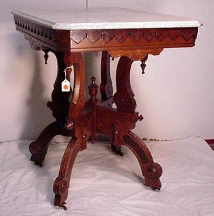 Carved wood ran along the top of couch and chair backs and arms, but you'd also find it on bed frames and dressers featuring shapely leaves. Victorian Walnut Marble Top Table. For Sale | Antiques.com ...
