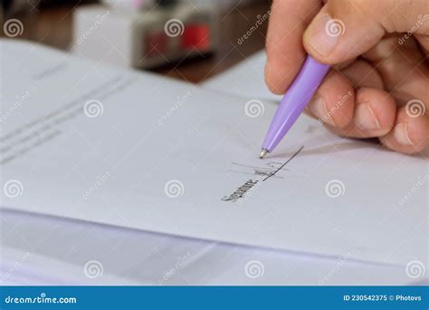 Man Signing Document Focus On Female Hand Holding Pen Putting