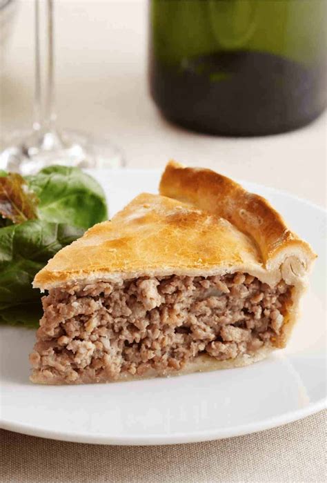 Using a potato masher, food mill, or ricer, mash potatoes with butter. Tourtière Recipe: How to Make the Best French Canadian ...