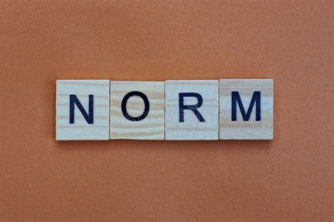 The Word Norm Consists Of Wooden Cubes With Letters Top View On A