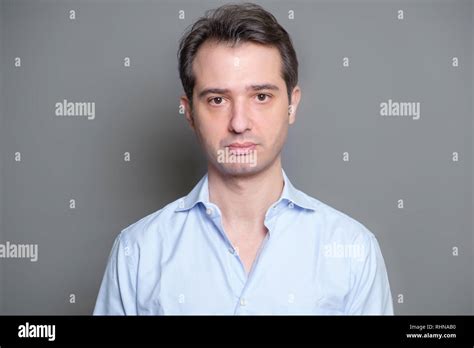 Serious Guy Face Expression Studio Portrait Stock Photo Alamy