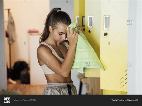 Babe Woman In Locker Room Finishing Workout In Gym Stock Photo OFFSET