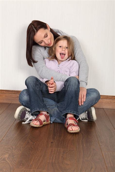 Young Mother And Daughter Sitting On Floor At Home Stock Image Image Of Daughter Hoodie 21234955
