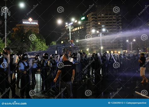 Riot Police Deploy A Water Cannon Against Protesting Crowds Editorial