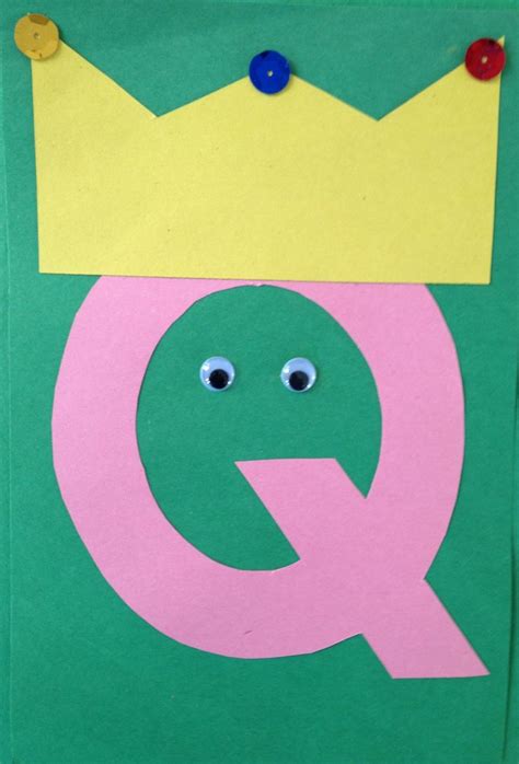 The Letter Q Is Made Out Of Paper With Googly Eyes And A Crown On Top