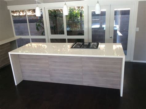 A brilliant ikea hack this waterfall kitchen island made from textured wood neatly tucks in another mini kitchen island with inlets and wheels. After photo of a beautiful IKEA Kitchen with Quartz ...