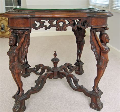 Antique Victorian Era Table With Carved Figure Legs And Beveled Glass