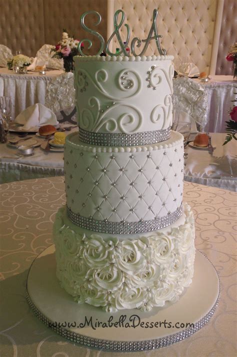 3 Tier All White Wedding Cake Decorated With Buttercream Rosettes