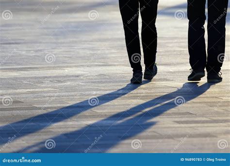 Legs Of Two People Coming Together In The Square Stock Image Image Of