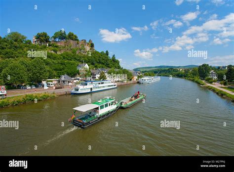 Barge And Excursion Ship On Saar River Above The Saarburg Castle