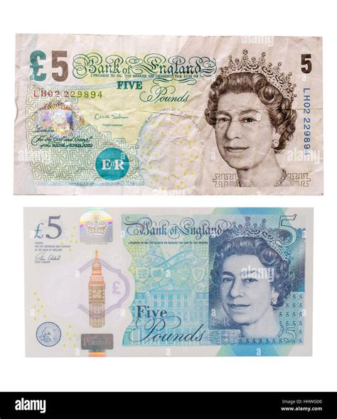 An Old Paper British Five Pound Note Above A New Polymer Or Plastic £