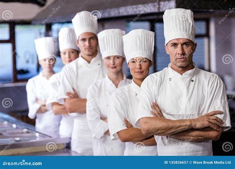 A Group Of Chefs Preparing Delicious Meal In High Luxury Restaurant