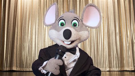 Download Chuck E Cheese Mascot In Suit Wallpaper