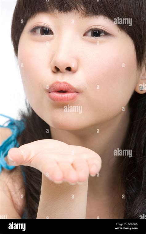 Young Woman Blowing A Kiss Stock Photo Alamy