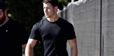 nick jonas flaunts bulging biceps in a skintight t shirt