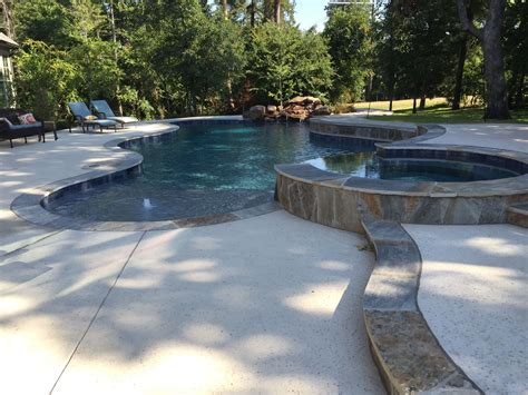 Inground pools can have 10 times as much water, which requires that many more chemicals. Freeform pool and spa with raised bond beam. | Small ...