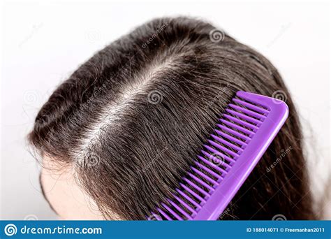 Choose from a vast range of parting comb on alibaba.com to achieve voluminous and beautiful hair. The Woman Is A Brunette, Parting Her Hair With A Comb And ...