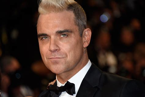 Robbie Williams new album: Take That singer announces Heavy ...