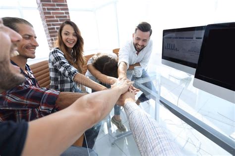Creative Business Team Putting Hands Together At The Office Stock Image