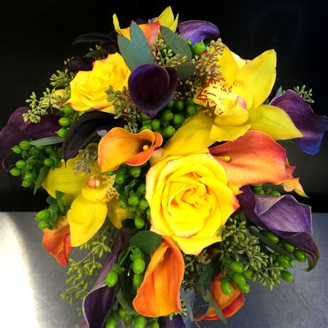 Purple and blue send a strong message of royalty, glory, and rest. Yellow, orange and purple bridal bouquet | Wedding flowers ...
