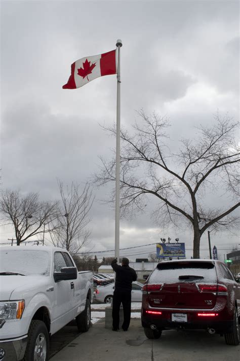 Canadian flag flies in front of the peace tower on parliament hill in ottawa. @Waterloo Ford will fly our #Canadian flag at half mast ...