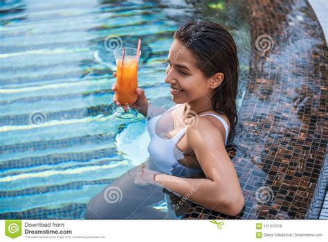 Cheerful Woman Tasting Beverage In Swimming Pool Stock Photo Image Of