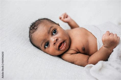 Happy Awake And Cute African American Newborn Baby Boy Laying On A