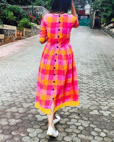 Check out our pink yellow dress selection for the very best in unique or custom, handmade pieces from our shops. Pink and yellow checks cotton dress by Threeness | The ...